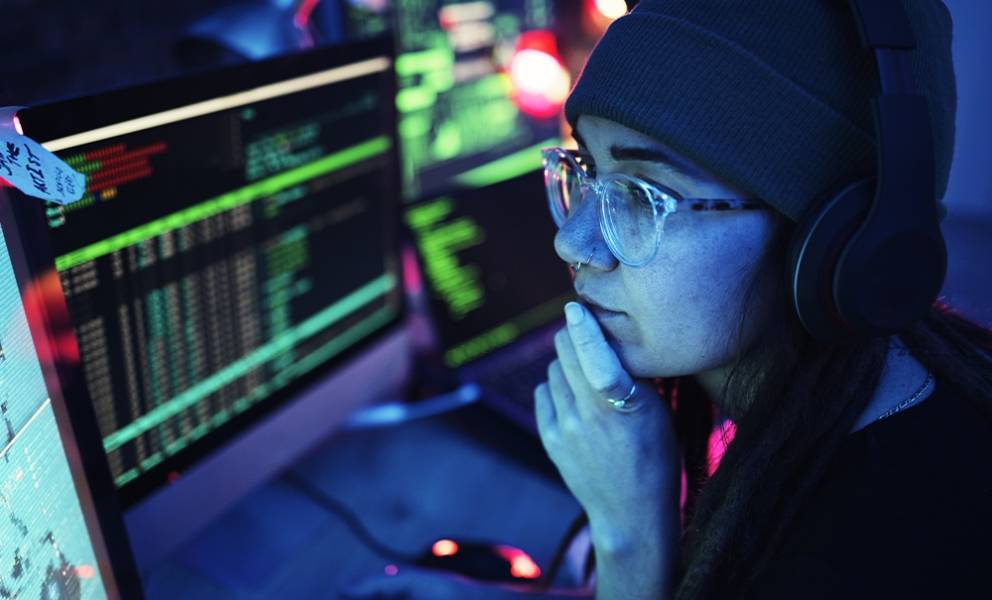 Young woman looks at screen