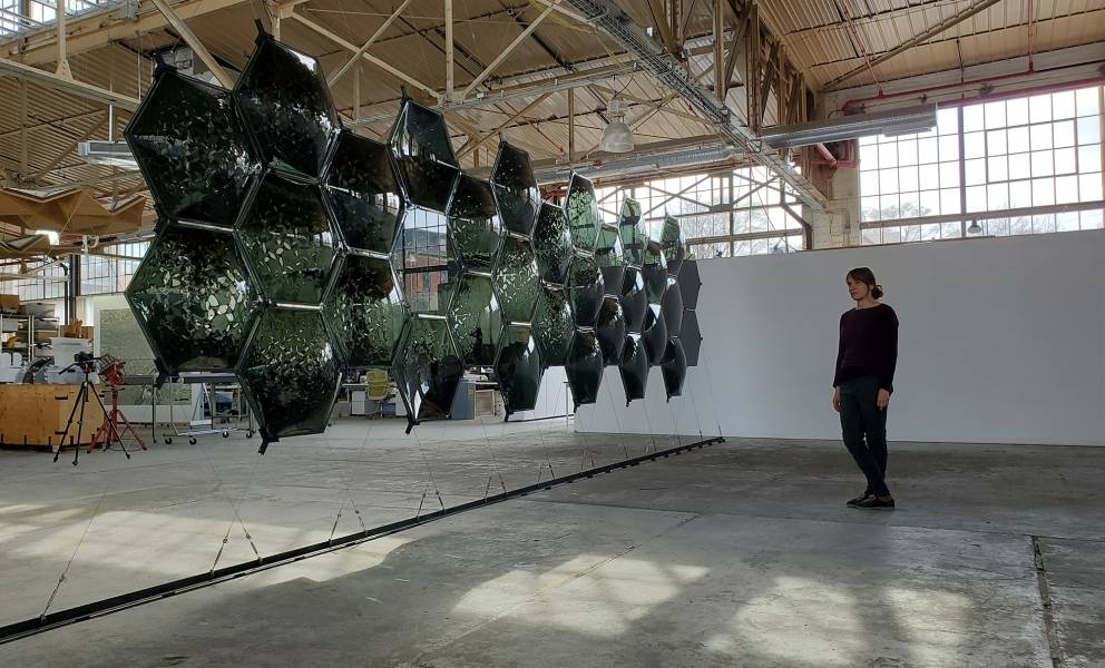 The two-layered wall system of Long Range with shifting variations in curvature, openings, and direction of curvature.